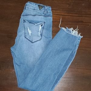 Red Bottoms Jeans Label That Says Red 